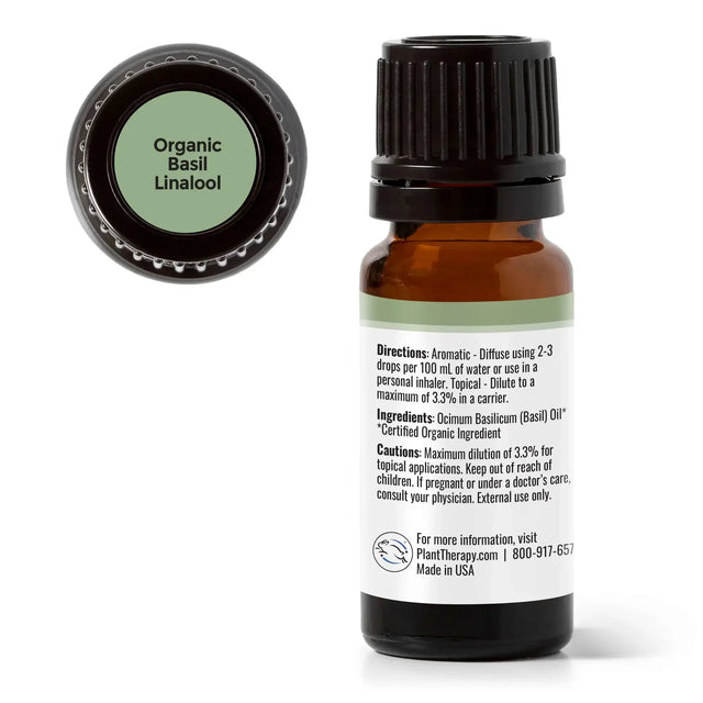 Organic basil linalool essential oil bottle with detailed label and black cap