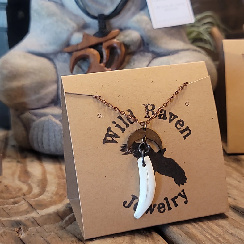Opossum tooth pendant