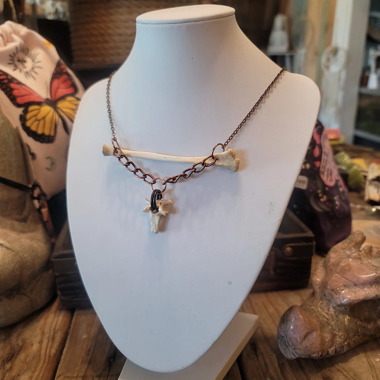 Opossum bone pendant