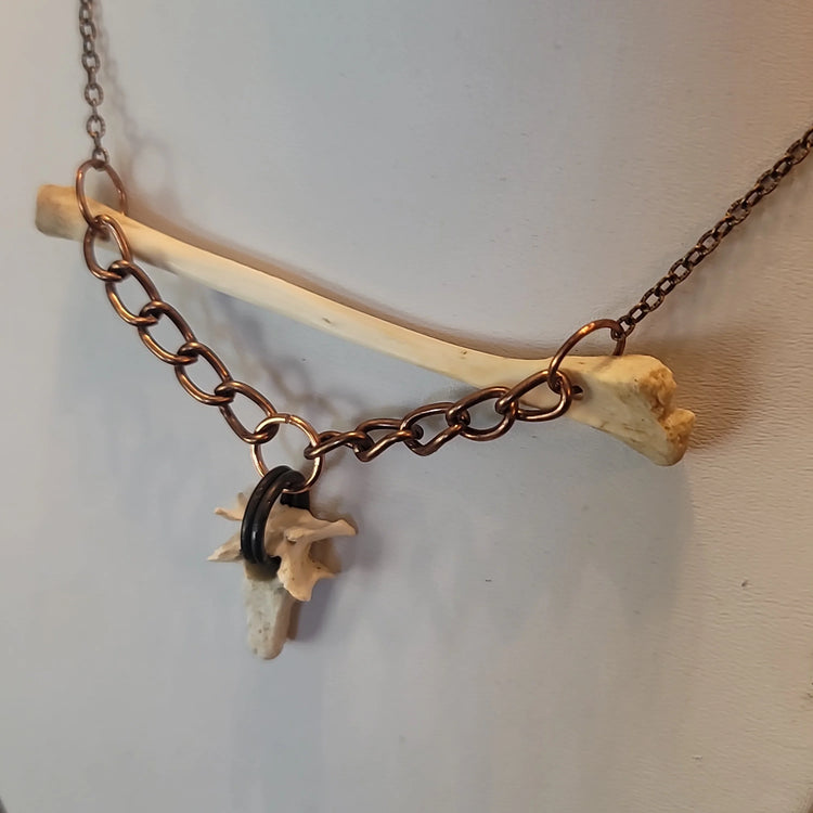 Opossum bone pendant