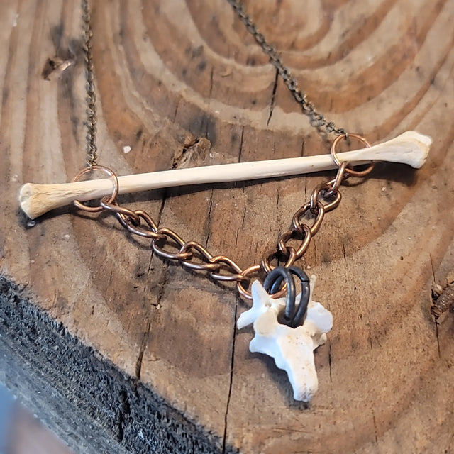 Opossum bone pendant