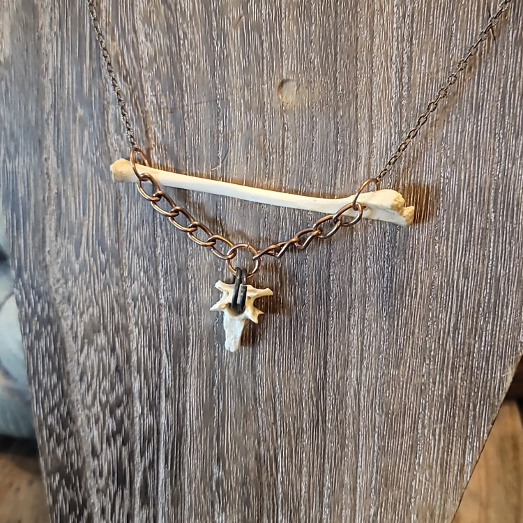 Opossum bone pendant