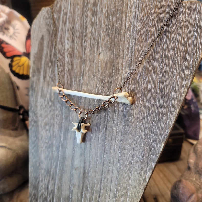 Opossum bone pendant