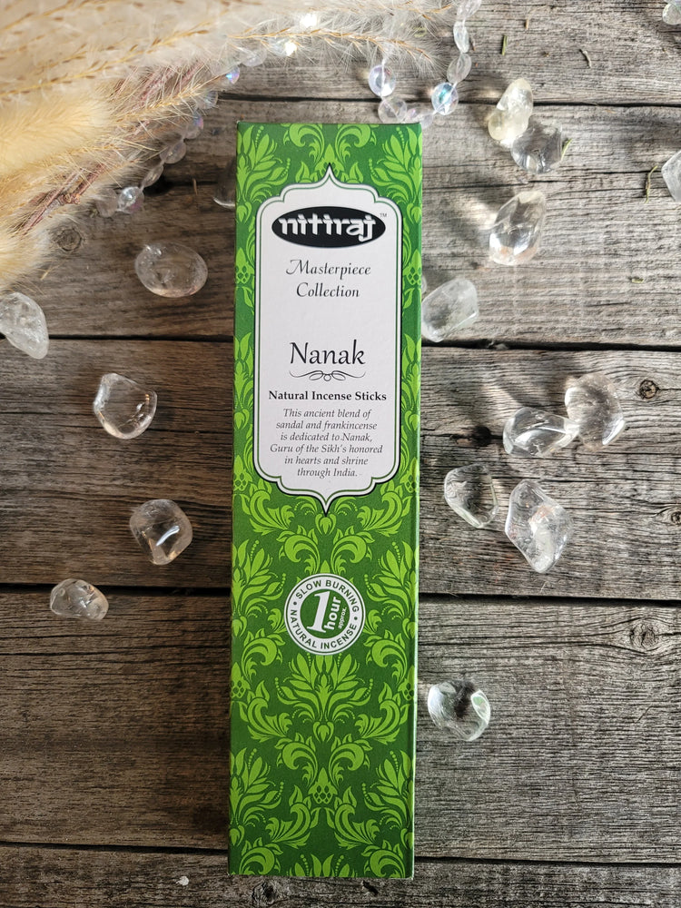 Nitiraj Nanak natural incense sticks box on wood with quartz crystals and dried grasses