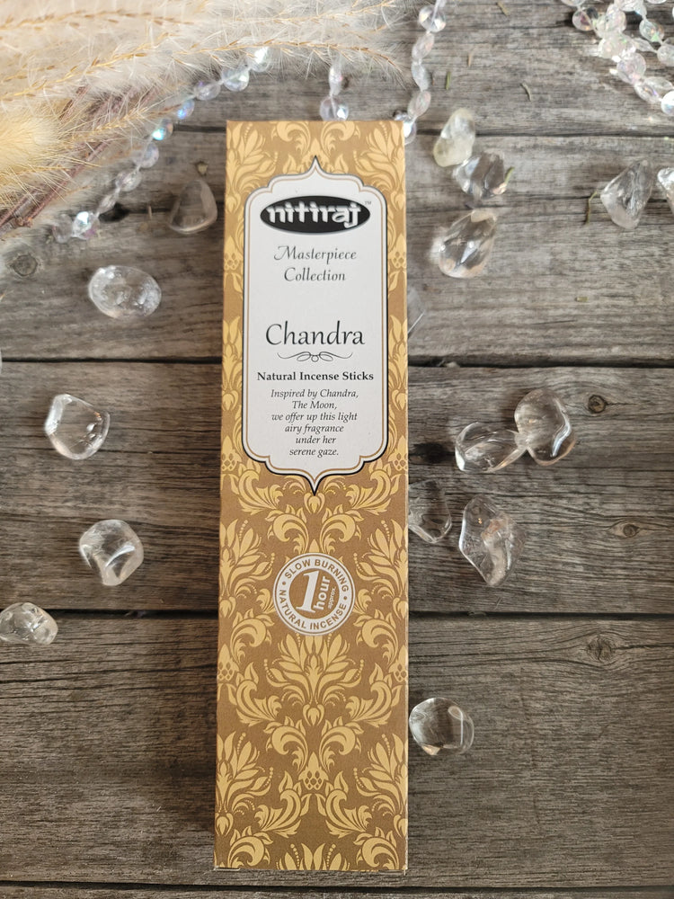 Nitiraj Chandra incense sticks box on rustic wood with quartz crystals and beads