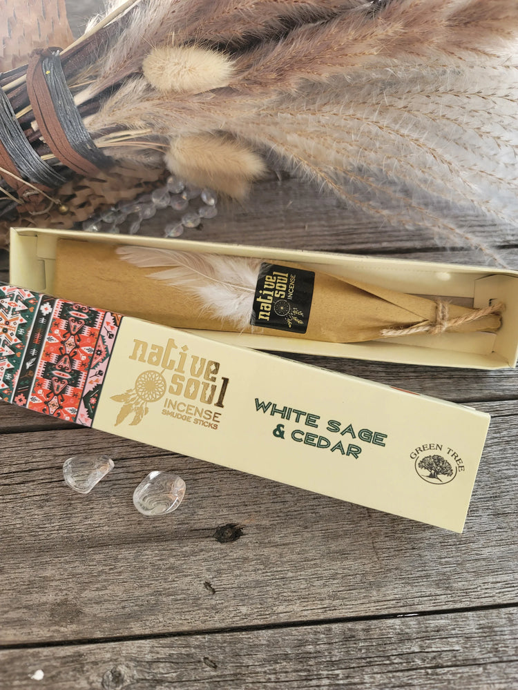 Native Soul White Sage and Cedar incense sticks box with feather and crystals on rustic wood