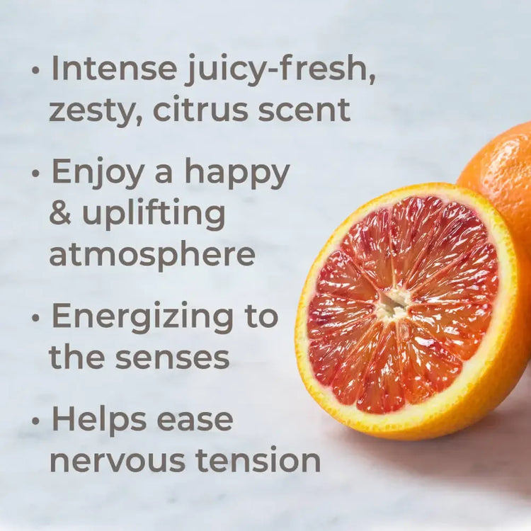 Blood orange half with juicy pulp on marble beside text about uplifting citrus scent benefits