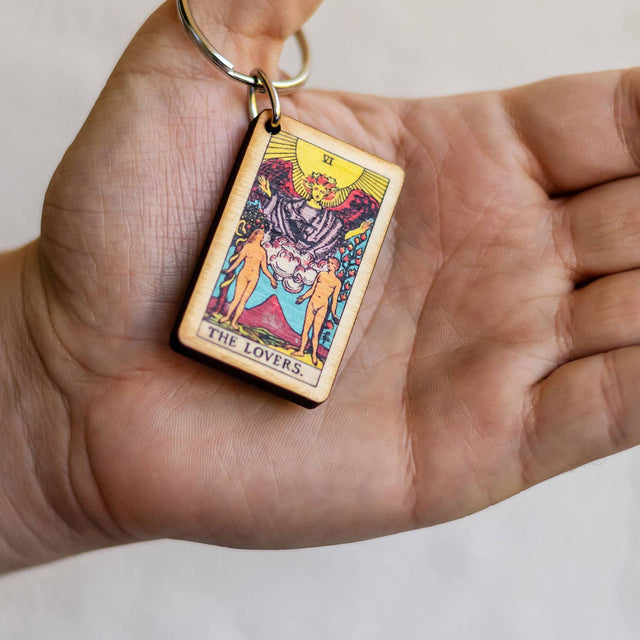 Wooden The Lovers tarot card keychain held in hand, metaphysical spiritual decor