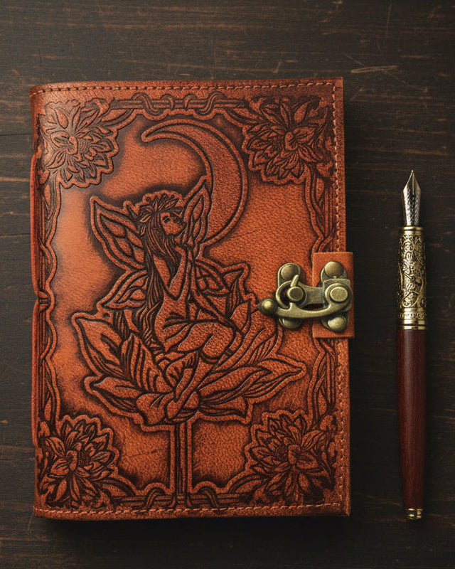 Leather journal with embossed fairy, crescent moon, lotus flower, and brass latch