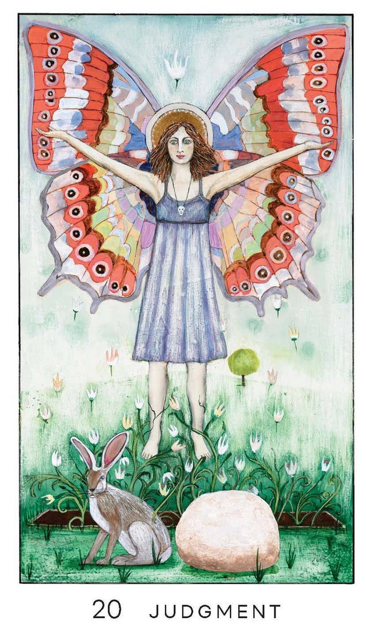 Judgment tarot card illustration with a woman with butterfly wings, a hare, and a stone in a grassy field.