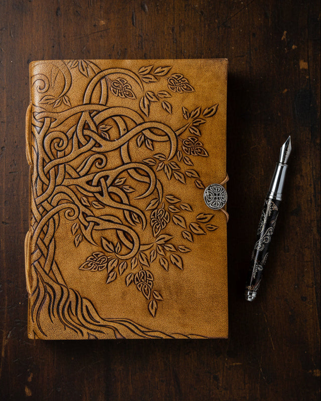 Embossed brown leather journal with Celtic tree of life design and metal clasp