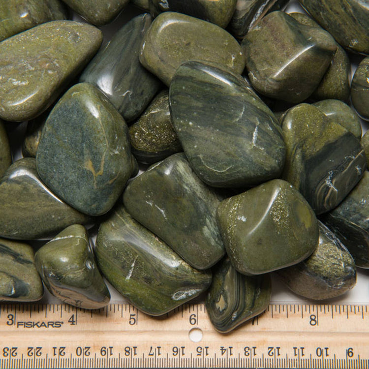 Tumbled green jasper stones with ruler for size, healing crystals for metaphysical use