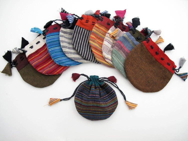 Assorted striped fabric drawstring pouches with tassels for crystals or tarot cards