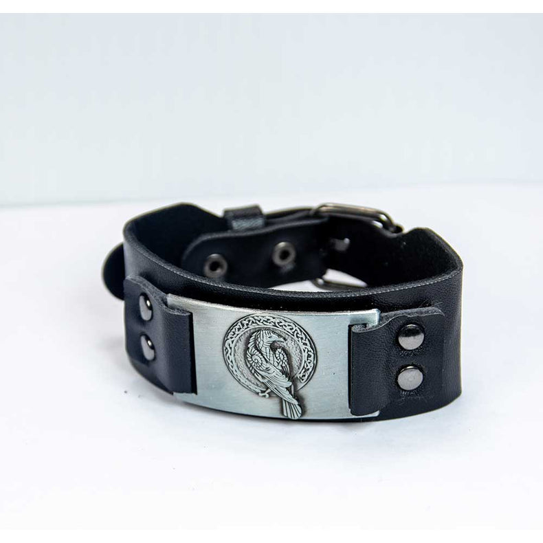 Black leather bracelet with engraved raven and Celtic motif, metaphysical jewelry.