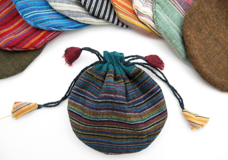 Colorful striped drawstring pouch with tassels, ideal for tarot cards or crystals