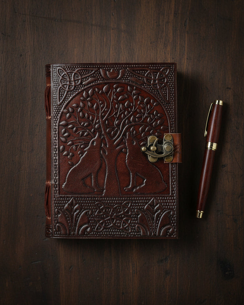 Leather journal with embossed tree of life and wolves, Celtic designs, and metal clasp