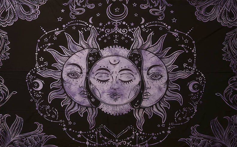 Black tapestry with a central sun and moon design, surrounded by floral patterns on a white background.