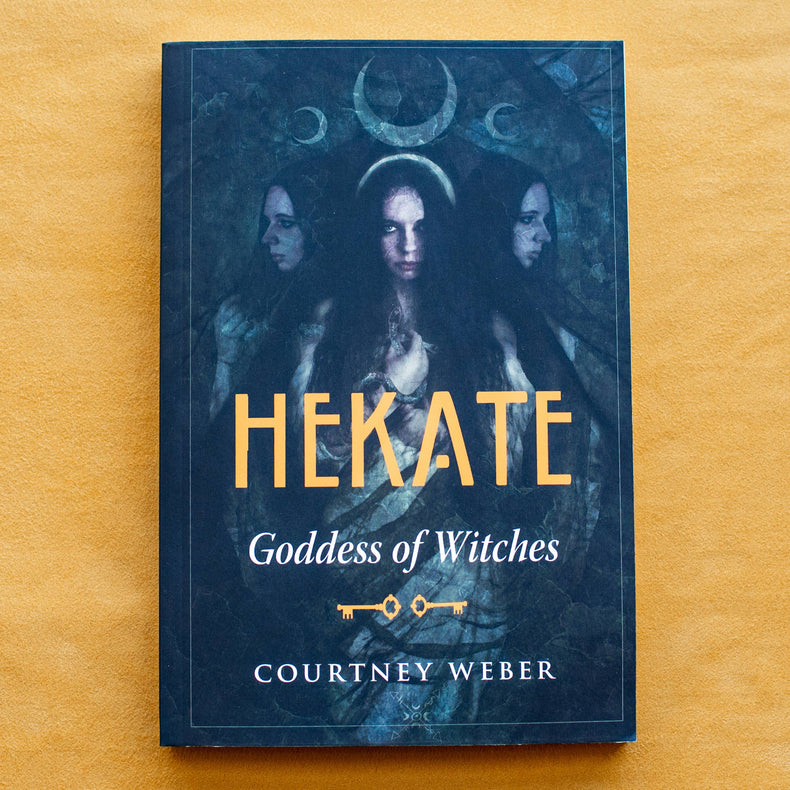 Hekate Goddess of Witches book by Courtney Weber on yellow background, mystical dark cover