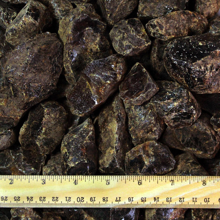 Raw brown rough crystals with ruler for size reference, metaphysical healing stones