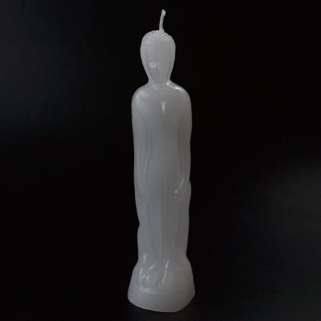 White Buddha-shaped candle for meditation and spiritual rituals, ideal for altars and healing spaces.
