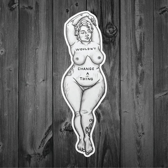 Wouldn't Change a Thing sticker shown on dark wood