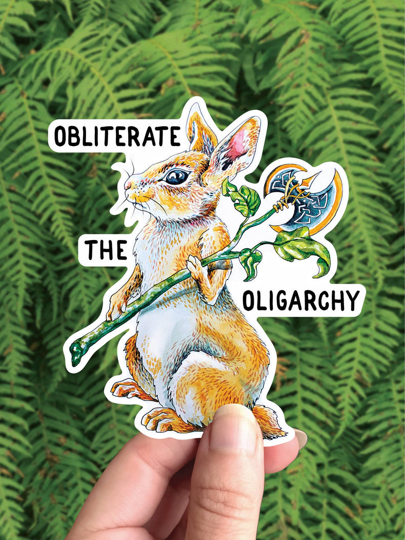 Obliterate the Oligarchy vinyl sticker, a wild rabbit holding a flower wrapped battle axe