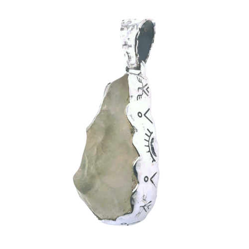 Rough crystal pendant in silver setting with engraved mystical symbols
