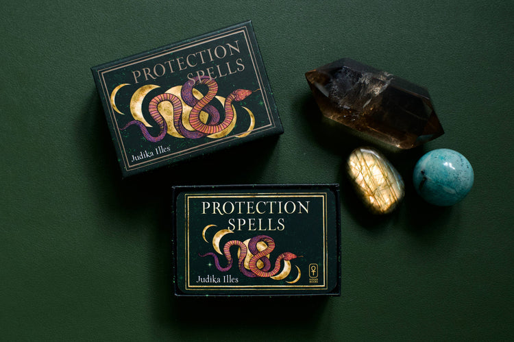 Protection Spells tarot deck with crystals on dark green background, metaphysical supplies
