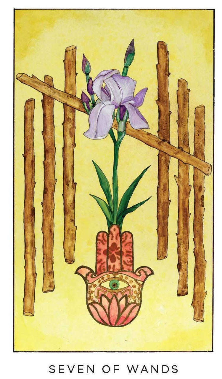Seven of Wands tarot card with purple iris, hamsa hand, and seven wooden wands on yellow background.