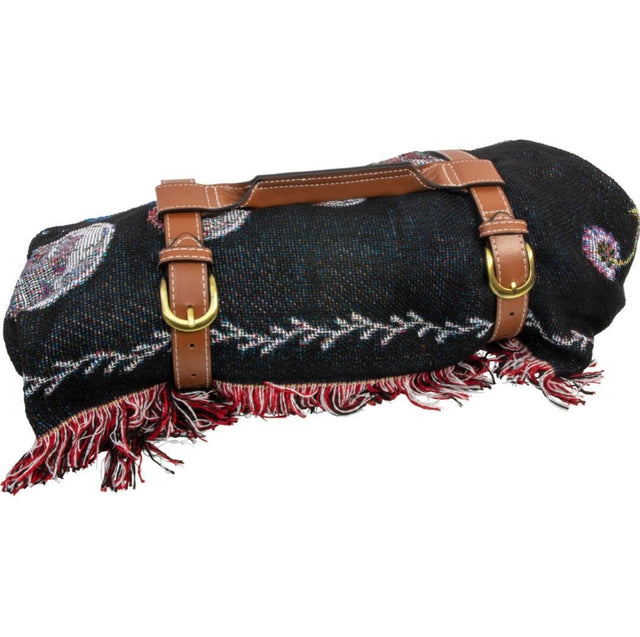 Black cotton mandala beach throw with fringe, rolled in brown leather carry straps