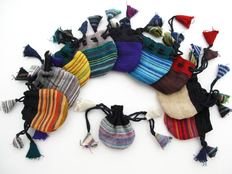 Colorful woven drawstring pouches in assorted striped patterns on a white background.