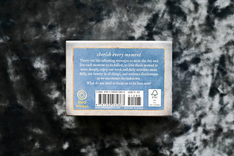 Back of a tarot or oracle card deck box with uplifting messages, barcode, and Red Wheel logo