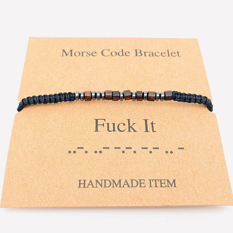 Handmade Morse code bracelet on card with message and black braided cord.