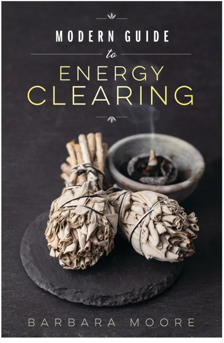 Book cover for Modern Guide to Energy Clearing with sage bundles and incense on slate