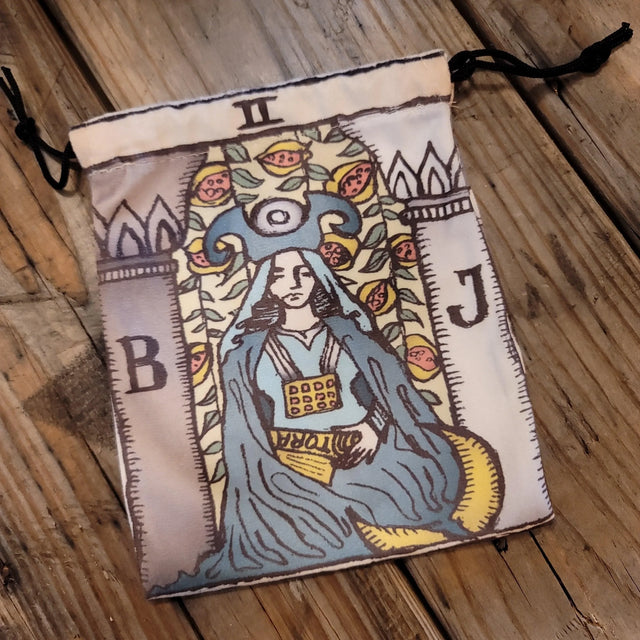 Tarot deck pouch featuring the High Priestess card design on rustic wooden surface
