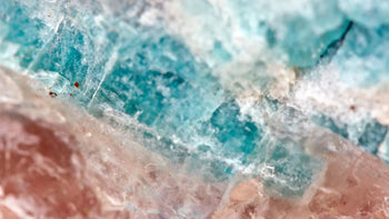 Close-up of blue and pink crystal mineral texture, highlighting natural healing stone patterns.