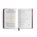 Open tarot journal featuring inner voice tarot spread layout and guided prompts for reflection.