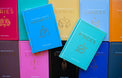 Colorful astrology books featuring zodiac guides for Aquarius and Pisces on display