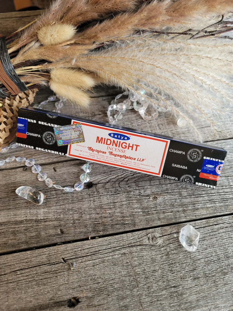 Satya midnight incense box with crystals and dried grasses on rustic wood background