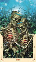Tarot card depicting two skeletons embracing in a mystical forest, cups in hand, symbolizing emotional connection.