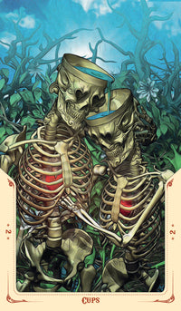Tarot card depicting two skeletons embracing in a mystical forest, cups in hand, symbolizing emotional connection.