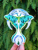 Begin Within vinyl sticker, a pale green luna moth between two crescent moons
