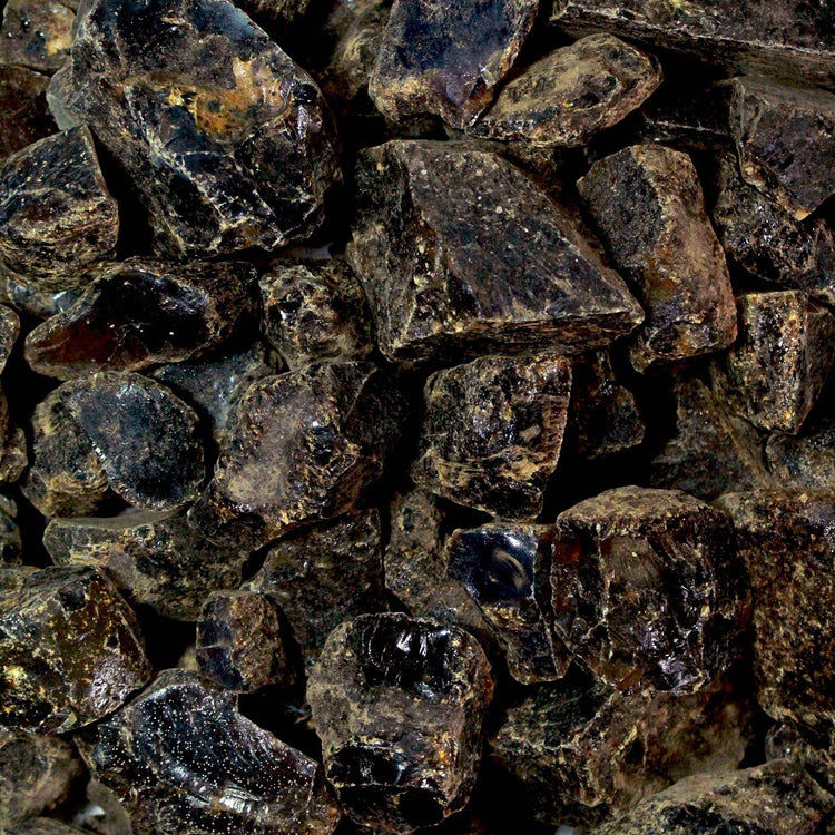 Close-up of raw black tourmaline healing crystals with rough, natural texture