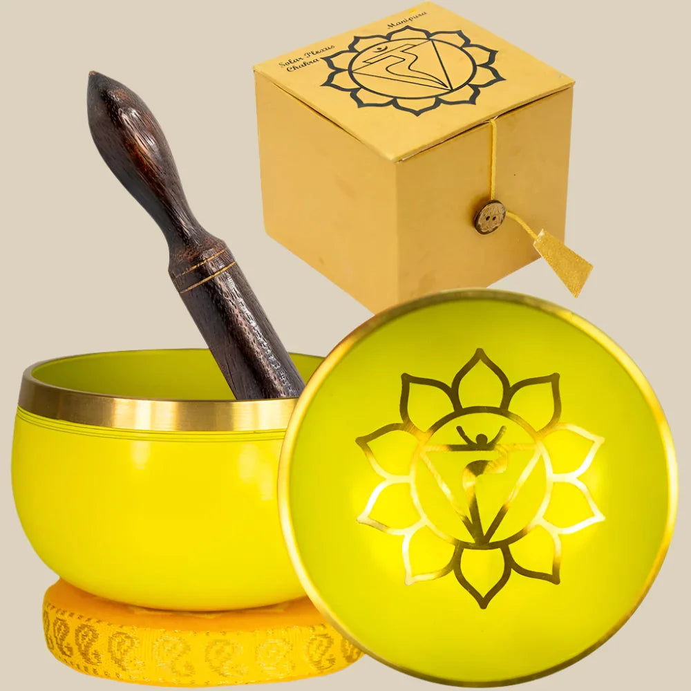 Yellow solar plexus chakra singing bowl set with cushion, striker, and box