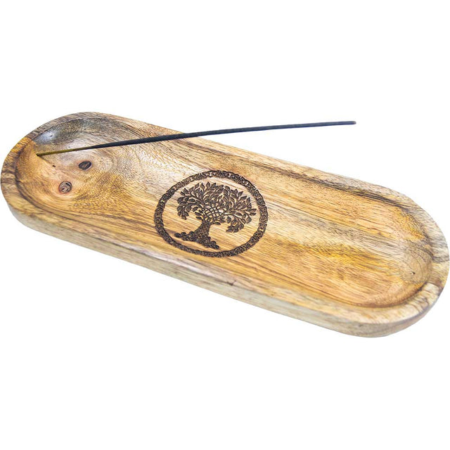 Wooden incense holder with engraved tree of life and burning incense stick