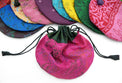 Colorful drawstring silk bags with intricate patterns for tarot cards or crystals