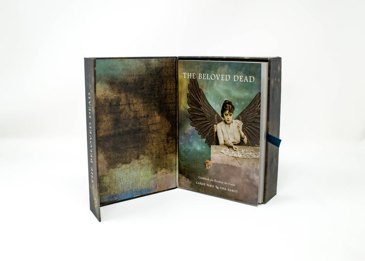 The Beloved Dead tarot deck box set with guidebook and mystical winged figure artwork.