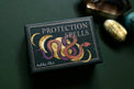 Protection Spells deck box with moon phases, snake illustration, surrounded by healing crystals.