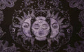 Black tapestry with a central sun and moon design, surrounded by floral patterns on a white background.