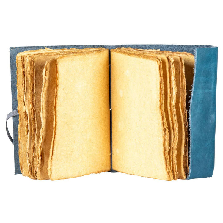 Handmade leather journal with blank deckle edge pages, open for writing or sketching